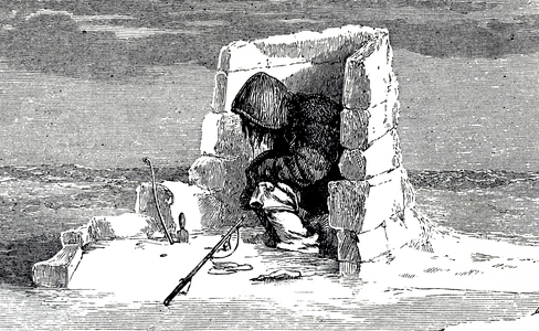 An Eskimo watching a seal hole