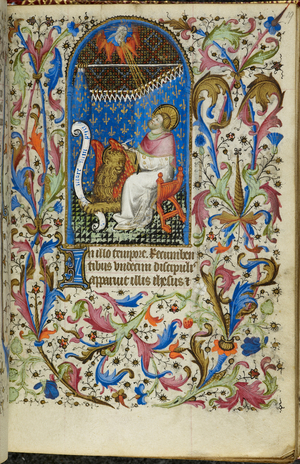 Mark writing, with his evangelist symbol, a winged lion, in front of him, with an illuminated initial 'I'(n) and a full foliate border