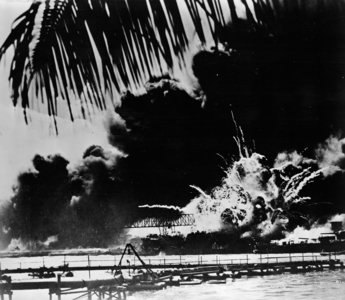 Pearl Harbor naval base and U.S.S. Shaw ablaze after the Japanese attack, 1941 (b/w photo)