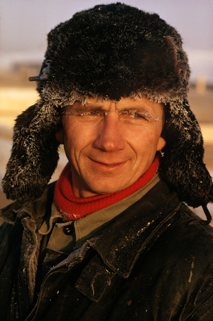 A robust construction worker takes a break from building apartments. Near Khanty Mans…, 1970s (photo)