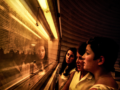 Israeli girls view framents of the Temple Scroll in the Shrine of the Book, part of Israel Museum, 1968 (photo)
