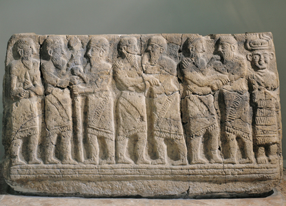 Three pairs of warriors embracing to seal peace treaty