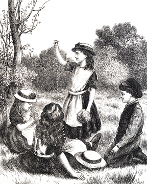 Young girls making daisy chains