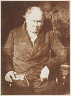 Professor Alexander Monro. Half-length seated portrait, full-face, of the Professor of Anatomy Alexander Monro (1773-1859), holding a leather-bound volume in his right hand.