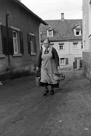 Grandmother going shopping down in the village, Germany 1930s (b/w photo)