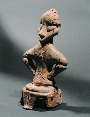 Seated female idol (terracotta)
