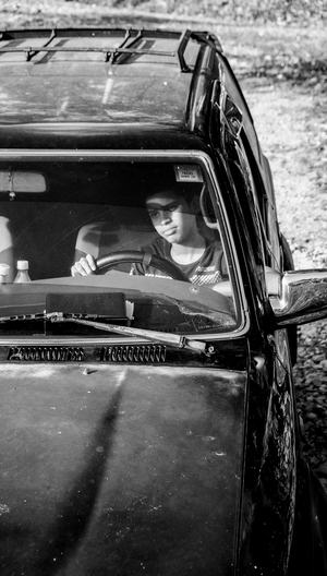 Young boy driving a 4x4, village of Caizan, province of Chiriqui, Panama, 2016 (photo)