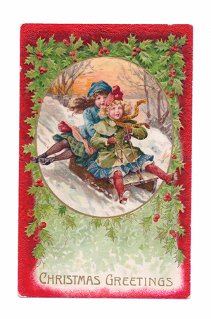 Edwardian Christmas postcard of two girls sliding down the snow in a cart, c.1910 (colour litho)