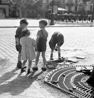 Children playing in the street in Paris, 1951 (b/w photo)