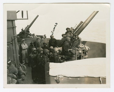 James Lane firing a gun on the deck of the USS Indianapolis, 1942 (b/w photo)