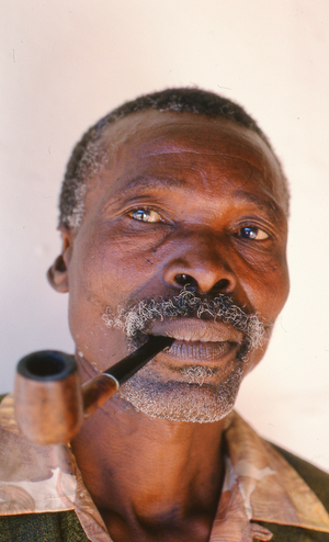 Apartheid political activist Lanford Ganyile with a pipe, 1978 (film still)