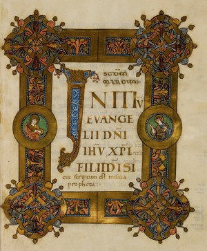 Initial 'I'(nitium) with interlace decoration and display script in gold, framed by a 'Winchester style' foliate border with two medallions with saints holding books (Evangelists?), at the beginning of Mark
