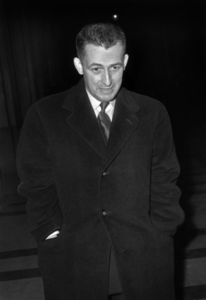 Colonel Antoine Argoud After Having Made His Deposition At The First Hearing In Camera At The Proceedings Of The Barricades Here Leaving The Court Room At The Palace Of Justice December 21, 1960 Neg: B9863 (b/w photo)