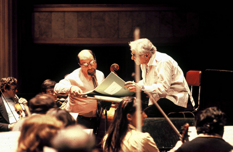 Composer and conductor Leonard Bernstein (right, USA) talks with a member of..., 1984 (photo)