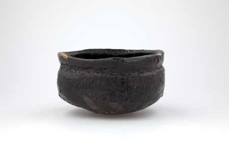 Triangular black tea bowl (stoneware glaze, Oribe ware)