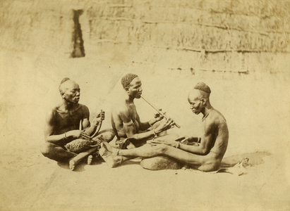Three Acholi musicians playing harps and flute, 1879 (albumen print)