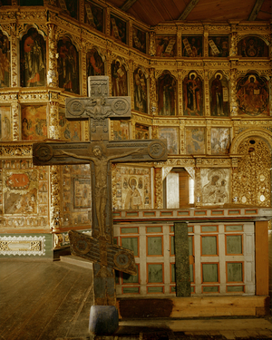 A wooden cross with an ematiated Christ under the figure of God the Father (photo)