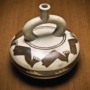 Moche ceramic pot vessel decorated with amputated or severed legs and feet, 1989 (photo)