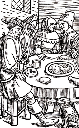 A meal in the Middle Ages: guests at table, 15th century (engraving)