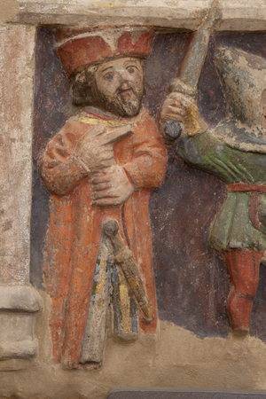 Altarpiece. polychrome stone. Second half 14th century. Origin former parish church of Torre de Rialb. Detail. Mid register. Left panel. Lower part: an official is looking at the scene at the beheading of Saint Iscle and the amputation of the breasts of Saint Victoria.