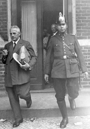 An official brings ballots to the Town Hall, 1932