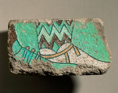 Fragment of an enamelled tile showing two feet with sandals turned to the right …