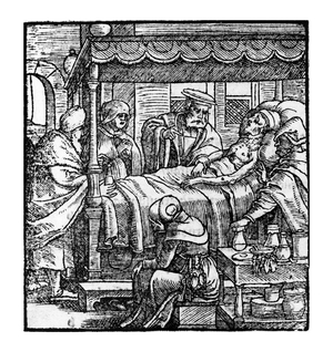 A bedside scene in a medical setting