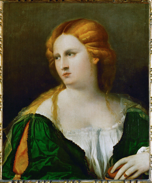 Young woman in a green dress, a box in her hand (poplar wood)