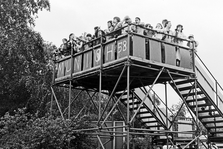 Tourists having look to the Eastern parts of Berlin from a viewing platform at Potsdamer Platz square, Germany 1984
