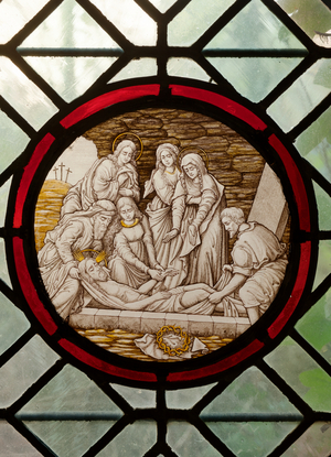 Former monastery (Zwartzusterklooster). The cloister. A stained glass window. Scene of Our Lady of Sorrows. The Burial of Jesus by Joseph of Arimathea.