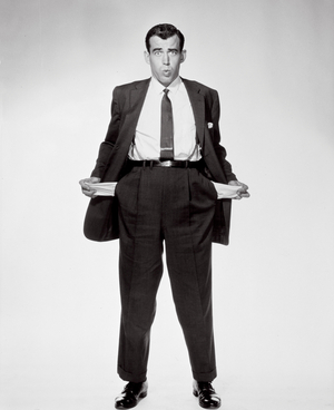 Portrait of a businessman showing his empty pockets