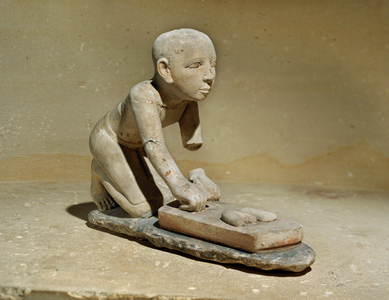 Model of a baker kneading his dough …