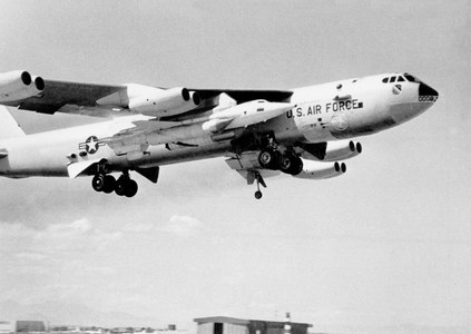The X15 rocket-powered aircraft rides under the wing of its B52 mother-ship as it is lifted skyward october 3, 1959 from Edwards Air Force Base in California