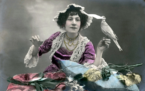 A woman with a dove holding a letter, c.1900-1910 (postcard)