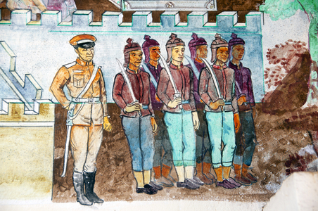 Thailand: Mural of soldiers in traditional uniform with an officer in modern uniform on the front of the viharn at Wat Si Khun Mueang, Chiang Khan, Loei Province