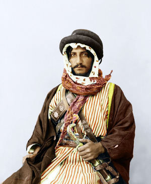 Palestine: A Palestinian Bedouin of means and position, hand-coloured print, c. 1909