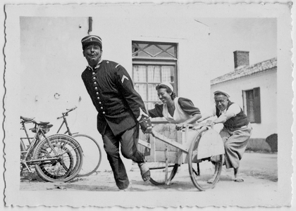 Friendly atmosphere for the Freton family on holidays in 1936, France (play with a wheelbarrow)