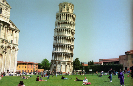 Tourists relaxing on a meadow in front of the Leaning Tower in Pisa, building, exterior view..., 1992 (photo)