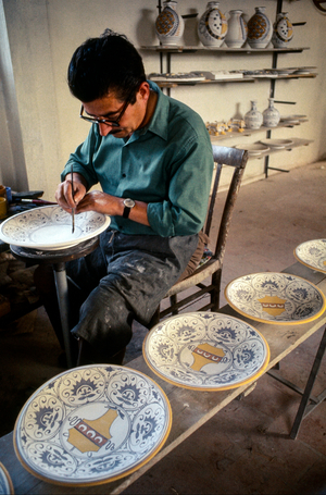 Man Painting Ceramic Plates, 1971 (photo)