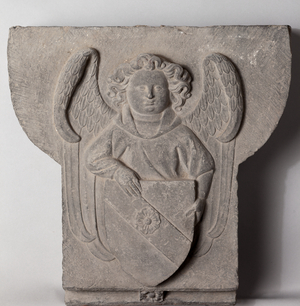 Voussoir of a fireplace (Claveau central de cheminée). An angel with eschuteon. Stone. From the Museum of History and Archeology of Tournai (musée d'histoire et d'archéologie de Tournai). Origin unknown. Second half of 15th century.