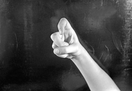 Letter X in finger alphabet (b/w photo)