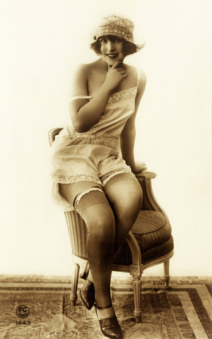 French Risque Lady in Lingerie A nude woman is sitting on an armrest ..., 1920 (photo)