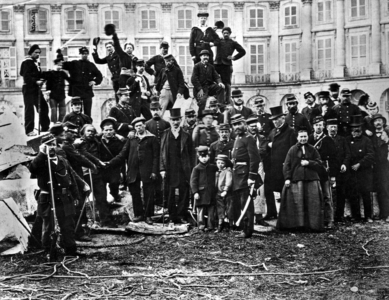 The communards are posing in front of the ruin of the Great Army Column on the Vendome Square (formelly called Conquests Square, then LouistheGreat Square, then Pikes Square under the FrenchRevolution), on may 16th, 1871, in Paris.