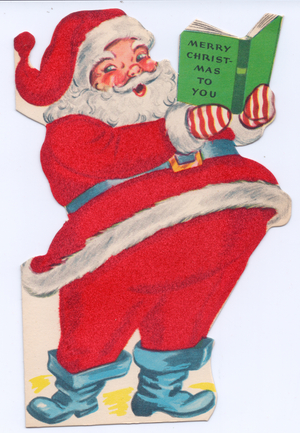 A die-cut Xmas Card of Father Christmas reading a book, his costume covered with red flocking, circa 1910 (coloured lithograph)