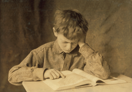 A boy reading, c.1924 (b/w photo)