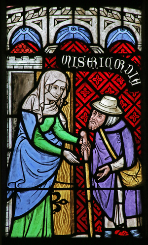 Window depicting the Works of Mercy: Welcoming the Stranger (stained glass)