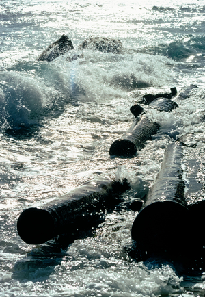 18th Century British cannons in the coastal surf of Bridgetown, Barbados, Caribbean