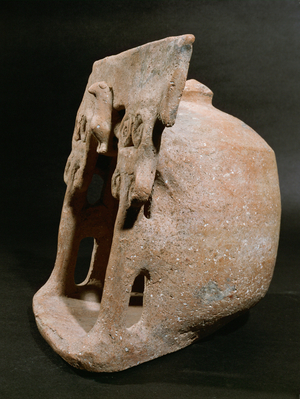 Small domestic shrine: model of a temple (clay)