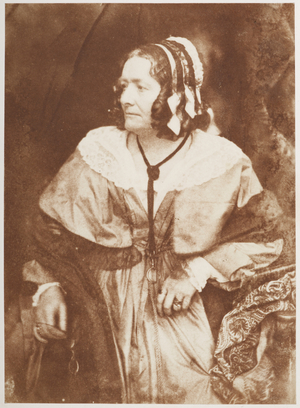 Mrs. Jamieson. Three-quarter length standing portrait, in half-profile, looking intently off to the left, of the art historian Anna Brownell Jameson (1794-1860).