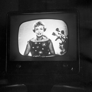 German TV presenter Angelika Feldmann from the NDR studios to a TV screen in Hamburg, Germany 1950s